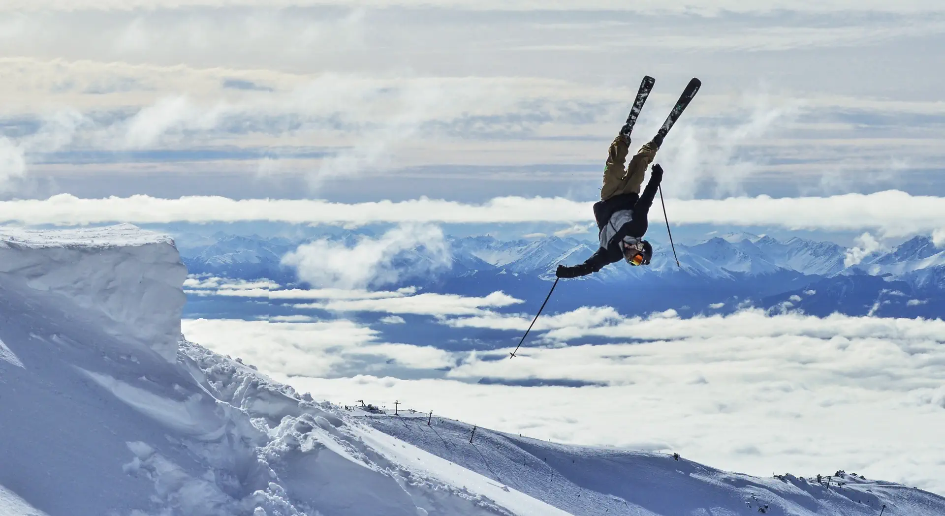 A skiier performing a backflip